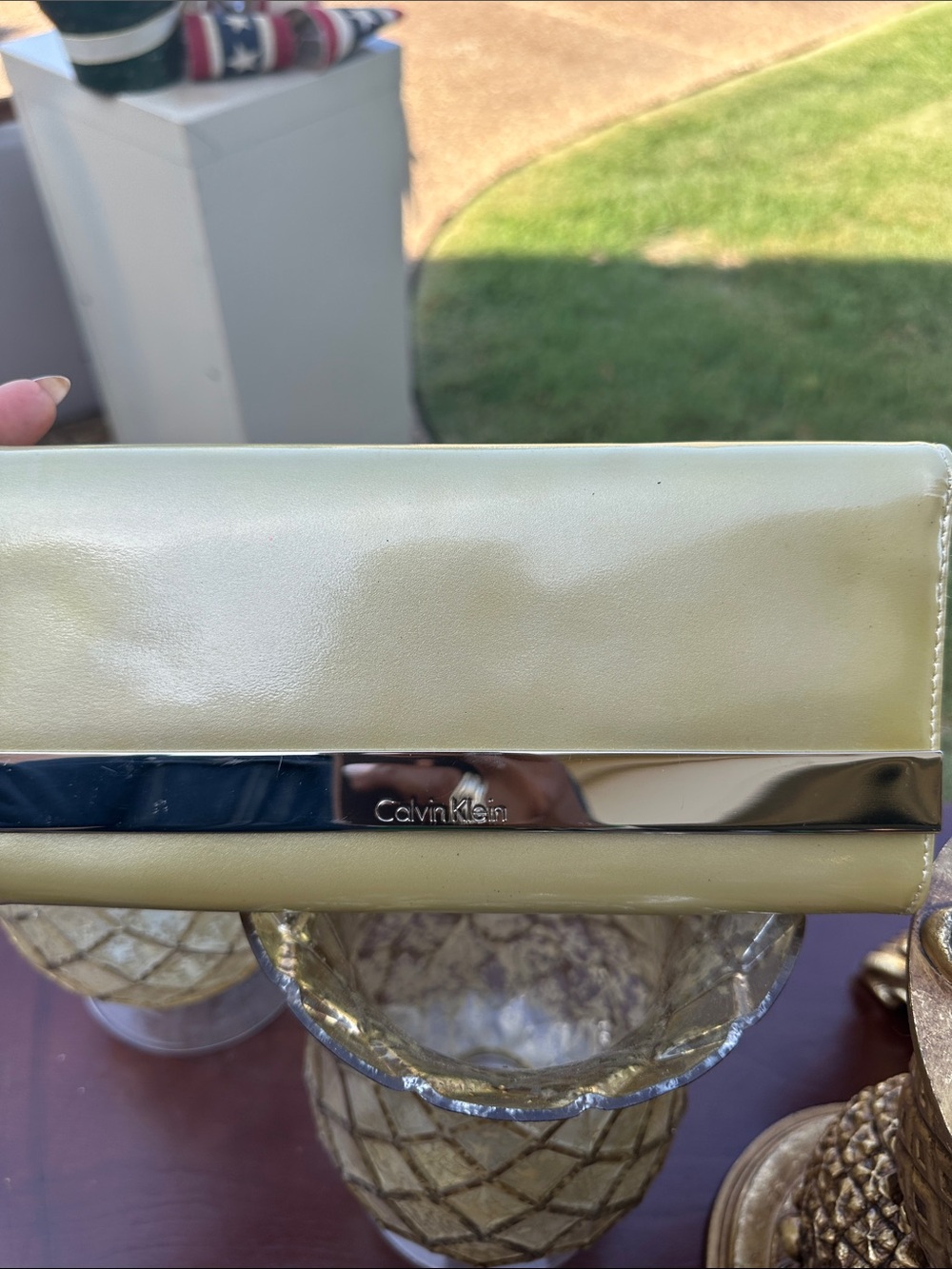 Calvin Klein Pale Yellow Leather Clutch with Polished Metal Trim